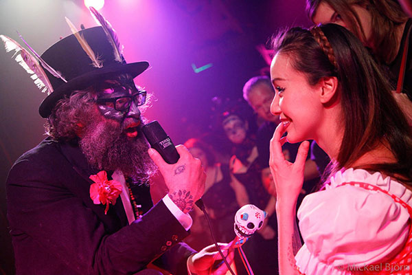 resident host Mr Weird Beard and the audience at the Los Muertos Halloween edition of the International Burlesque Circus